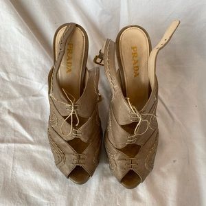 Prada nude heels with gold buckle
